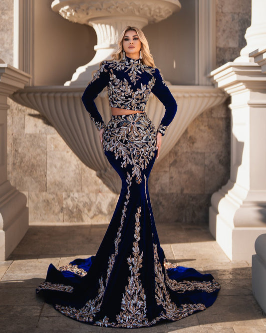 Tilda navy dress featuring long sleeves and sparkling crystal embellishments.