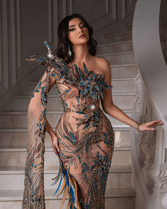 Trista one-shoulder dress with feather embellishment.