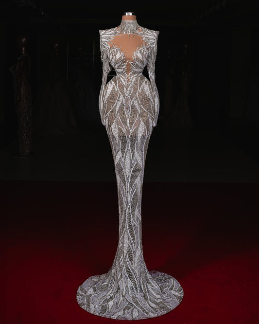 Yasra Bridal Dress featuring delicate crystal embellishments and a flowing silhouette for a regal style.