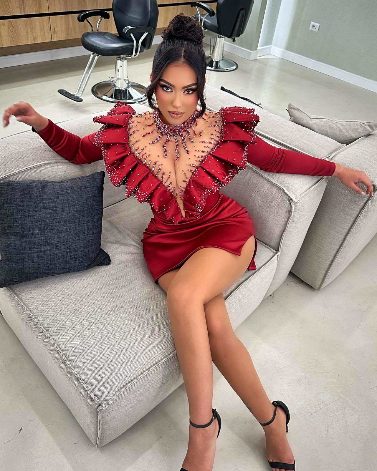 Alesia Bami wearing a stunning red dress by Blini