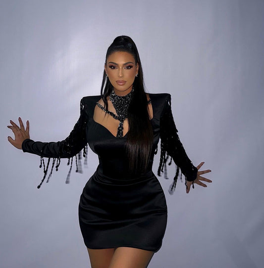 Alesia Bami wearing Blini's stylish black dress