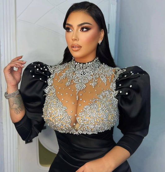 Stunning Alesia Bami donning Blini's black dress with grace and style