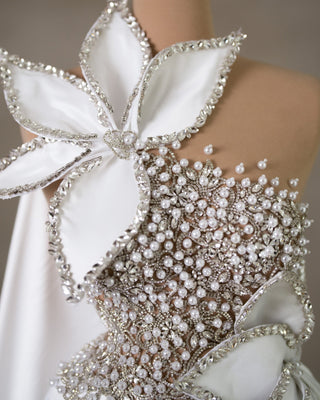 Close-up View of Crystal and Pearl Embellishments on Sleeveless White Satin Bridal Gown