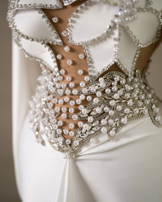 Close-up of Bodice Detail: Exquisite Pearls and Crystals Adorned on White Satin Bridal Dress