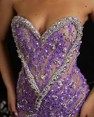 Exquisite detailing on the sleeveless purple dress.