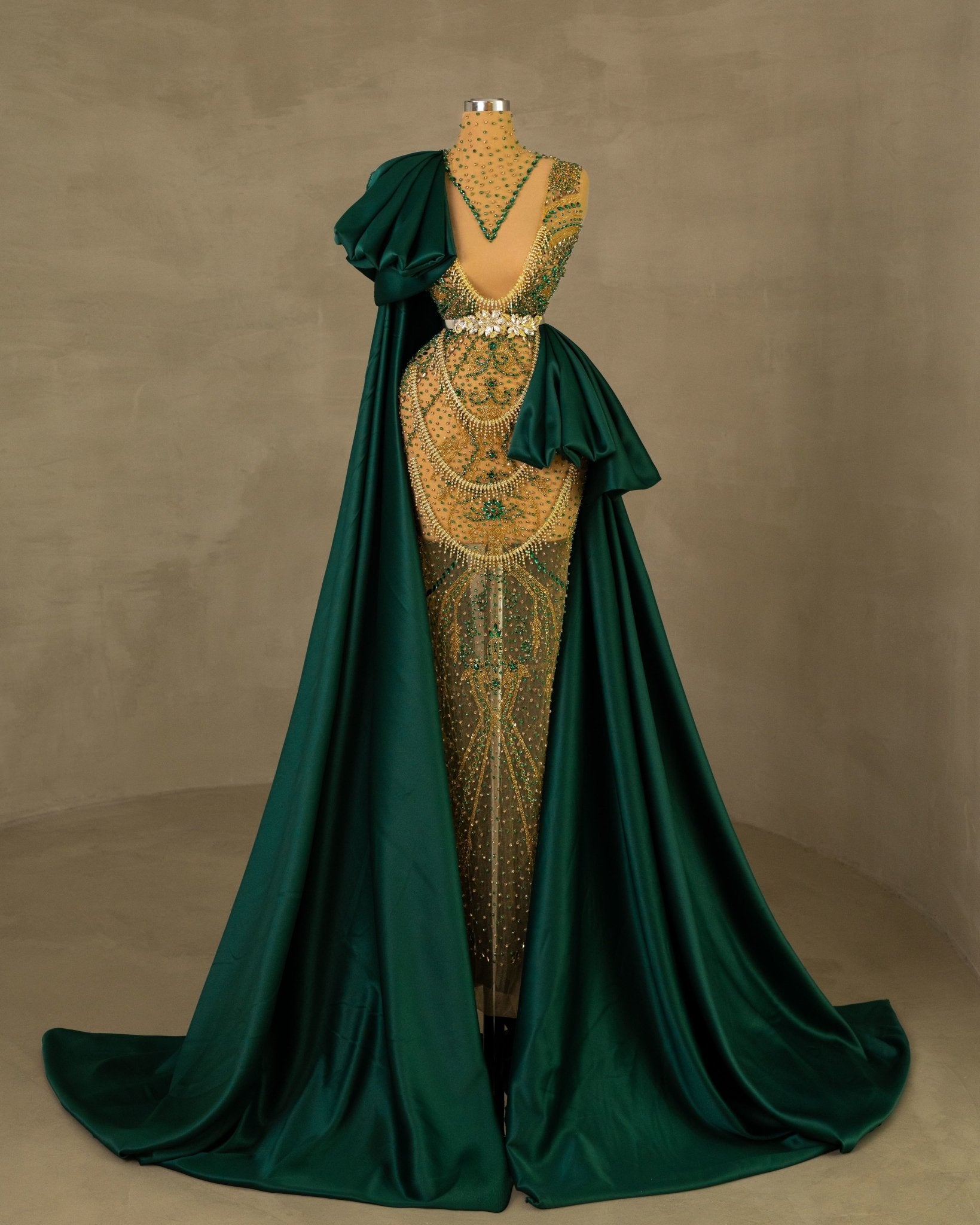 Elegant Gold Dress with Green Cape and Tail