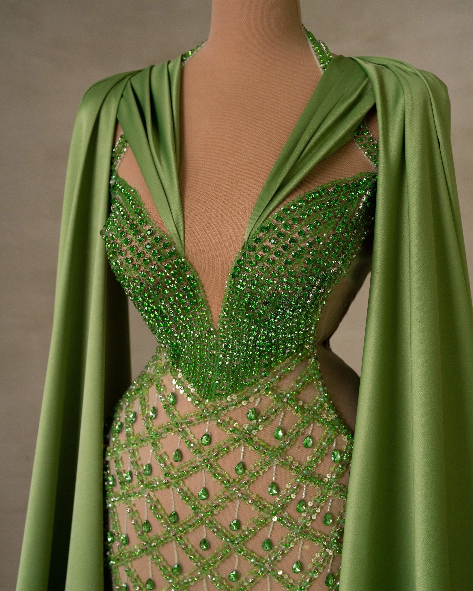 Intricate Gemstone Embellishments on Cape Dress