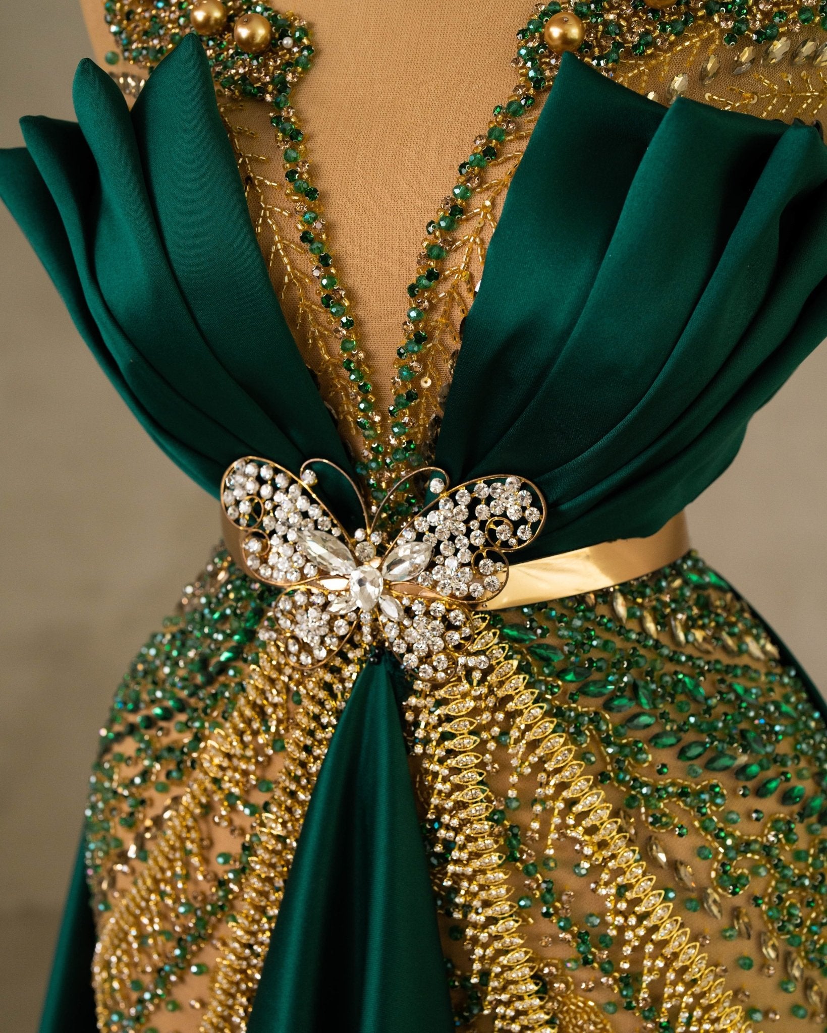 Close-Up of Sleeveless Dress Hem with Gold and Green Accents