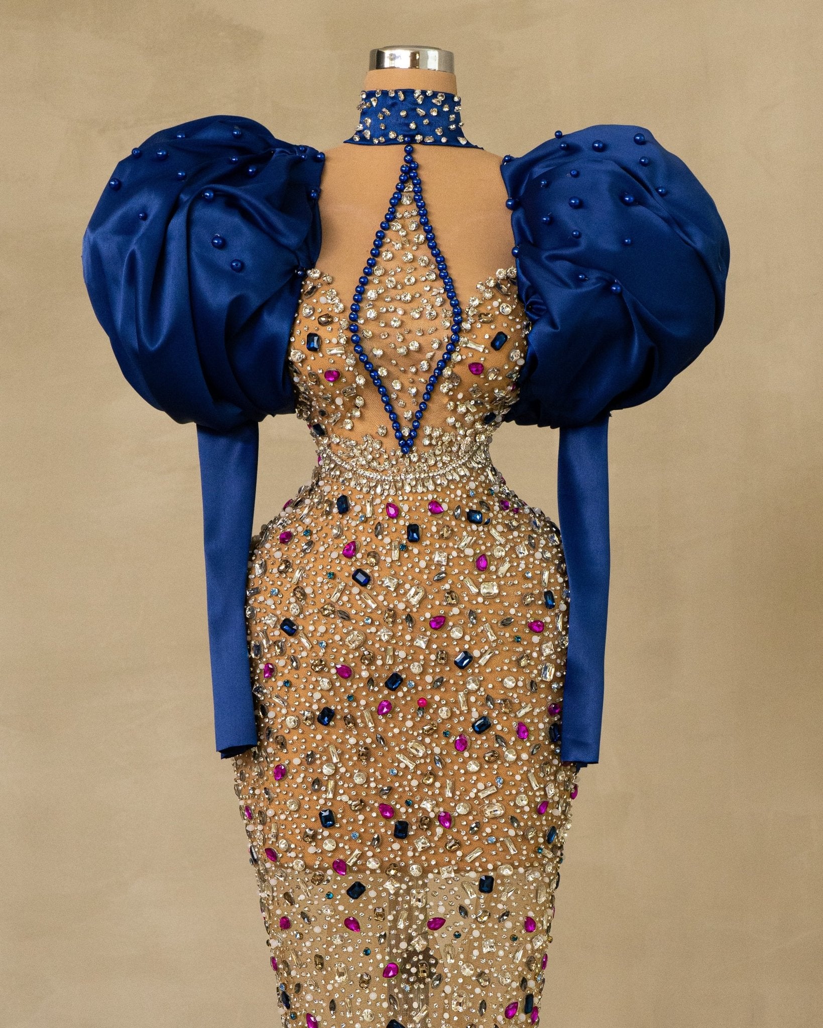 Stunning High Neck Puff Sleeve Dress: Elevate your style with this exquisite dress featuring high neck and puff sleeves, adorned with captivating stones.