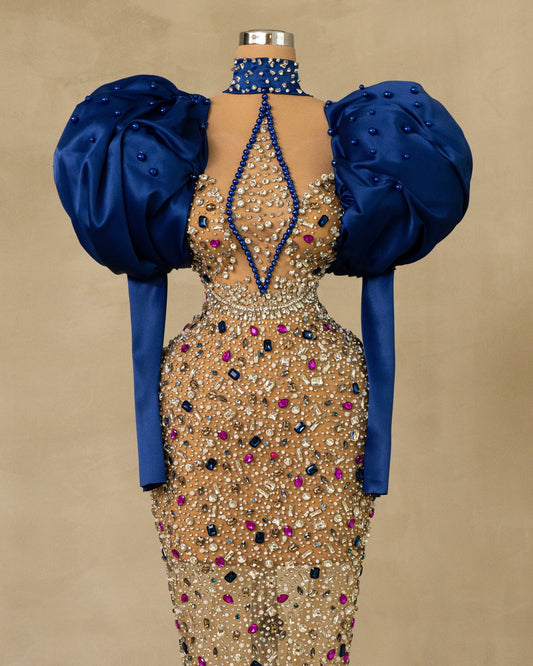 Stunning High Neck Puff Sleeve Dress: Elevate your style with this exquisite dress featuring high neck and puff sleeves, adorned with captivating stones.