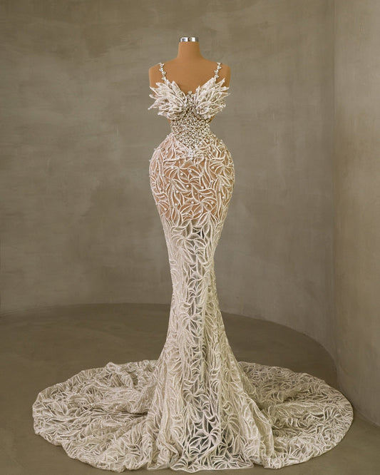 Luxurious Bridal Dress with Delicate Straps, Gemstone Accents, and Pearl Details