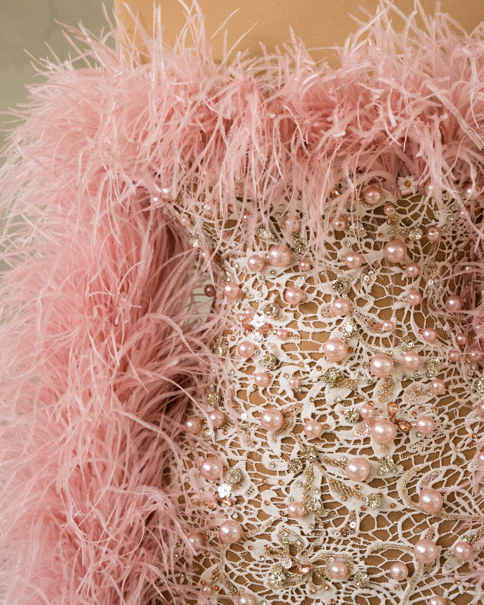 Close-Up of Pink Feather and Beads Detail