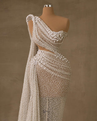 Elegant Bridal Gown Featuring Side Cape and Pearl Embellishments