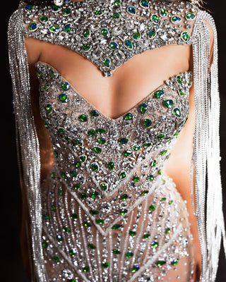 Close-up of a silver dress embellished with meticulously arranged silver stones