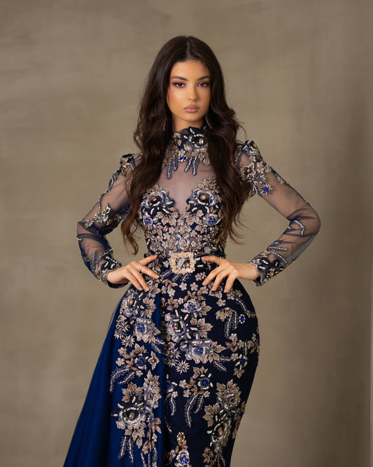 Lace dress with a high neck and long sleeves.