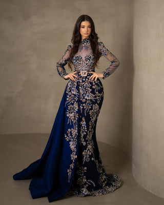 Dark blue lace dress with a high neck, long sleeves, and a flowing detachable side tail.