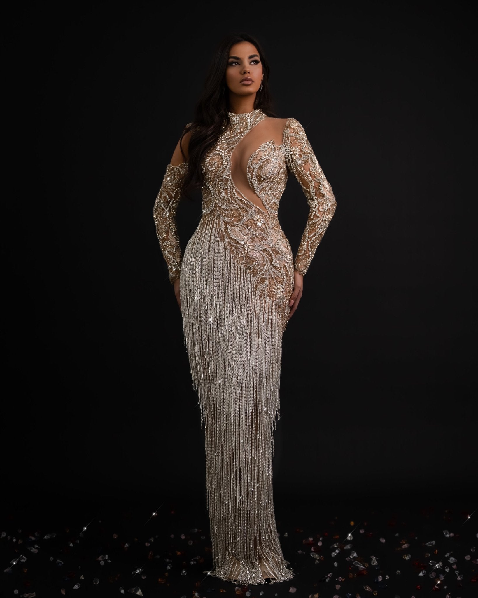 Elegant silver dress with cascading tassels, perfect for any occasion.