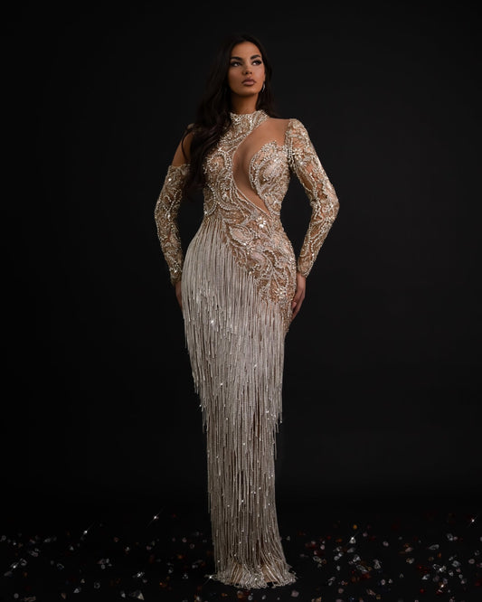 Elegant silver dress with cascading tassels, perfect for any occasion.