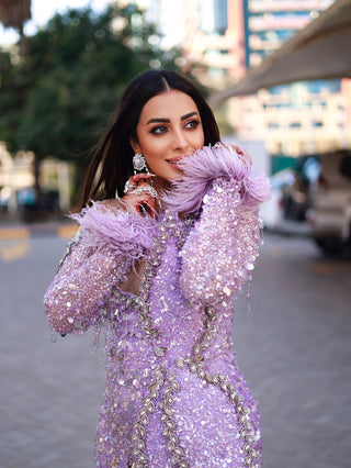 Graceful attire: Farzana Naz in Blini's stunning purple dress
