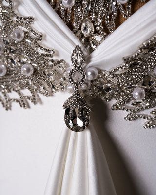 Wedding Gown showcasing a harmonious blend of crystals, pearls, and satin