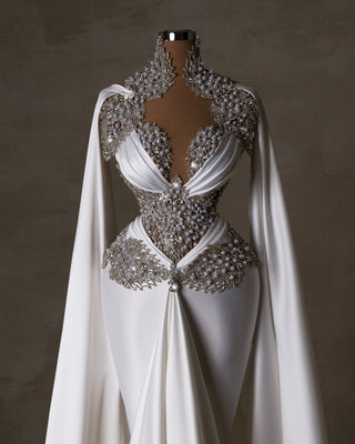 Satin bridal gown adorned with intricate pearl embellishments