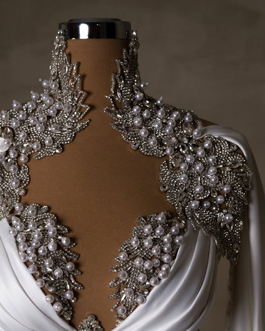 Elegantly designed wedding gown with crystal-studded high-neck feature