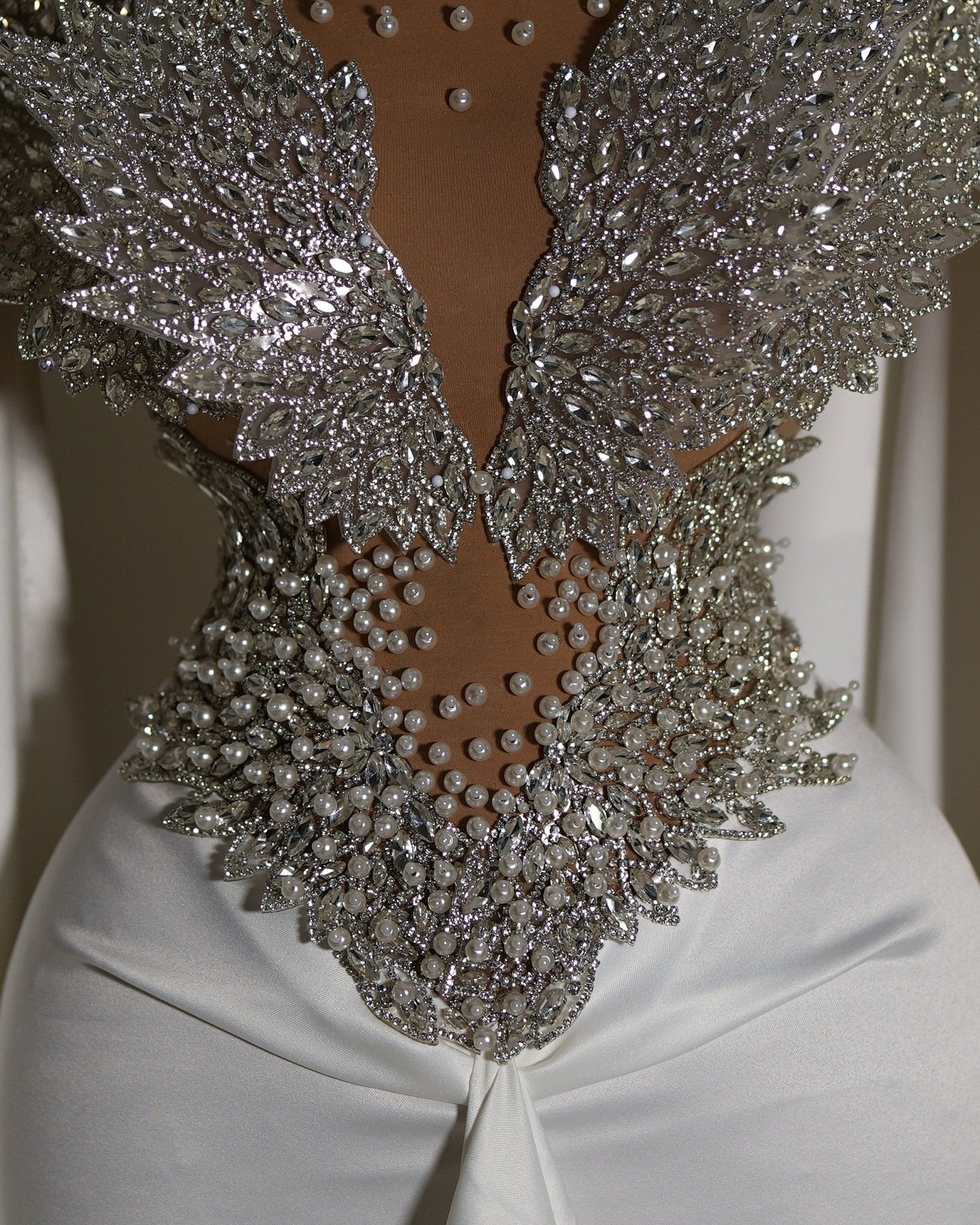 Majestic design in silver on a white gown.