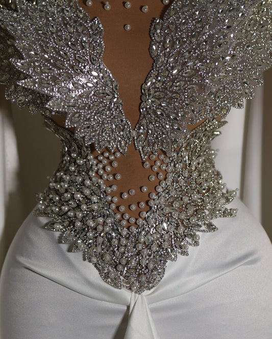 Majestic design in silver on a white gown.