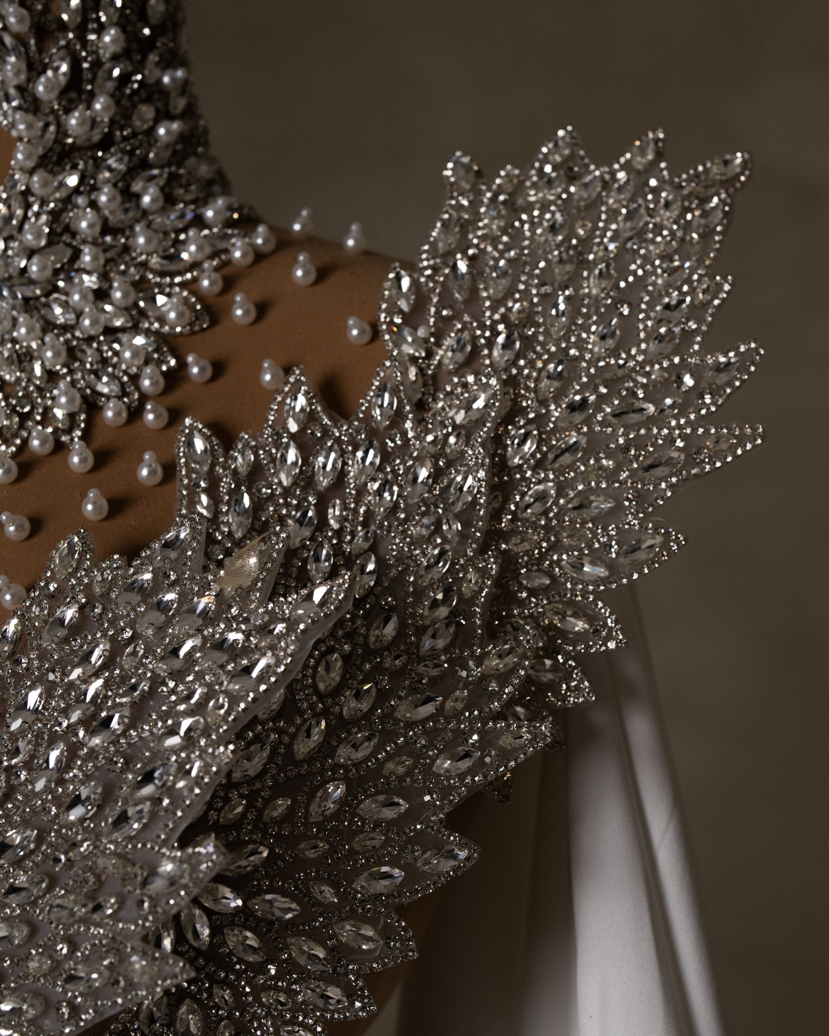 Intricate crystal design on bodice.
