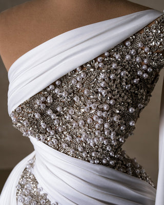 Intricate detailing: White pearls and crystals embellish the bodice.