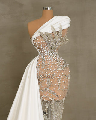 Luxe lace bridal gown with crystal leaf design and pearls.