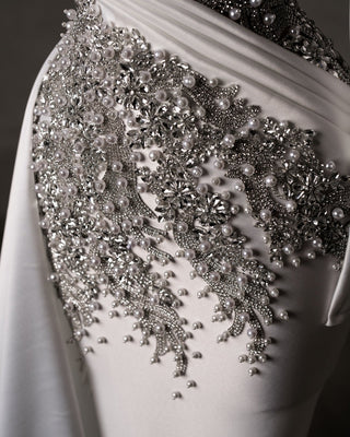 Detailed Close-Up of Bridal Dress with Pearls and Crystals