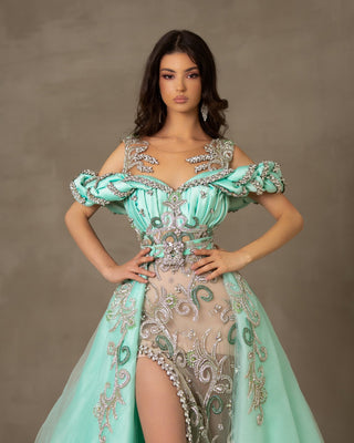 Mint-hued lace dress designed with a deep slit.