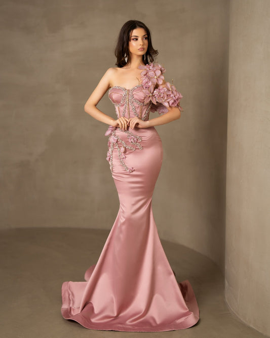 Pink satin one-shoulder dress adorned with floral sleeves and delicate stones.