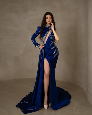 Long satin dress featuring a one-shoulder silhouette, high neck, and a daring chest-to-waist cut.