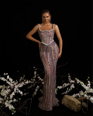 Gorgeous purple gown with intricate rhinestone embellishments.