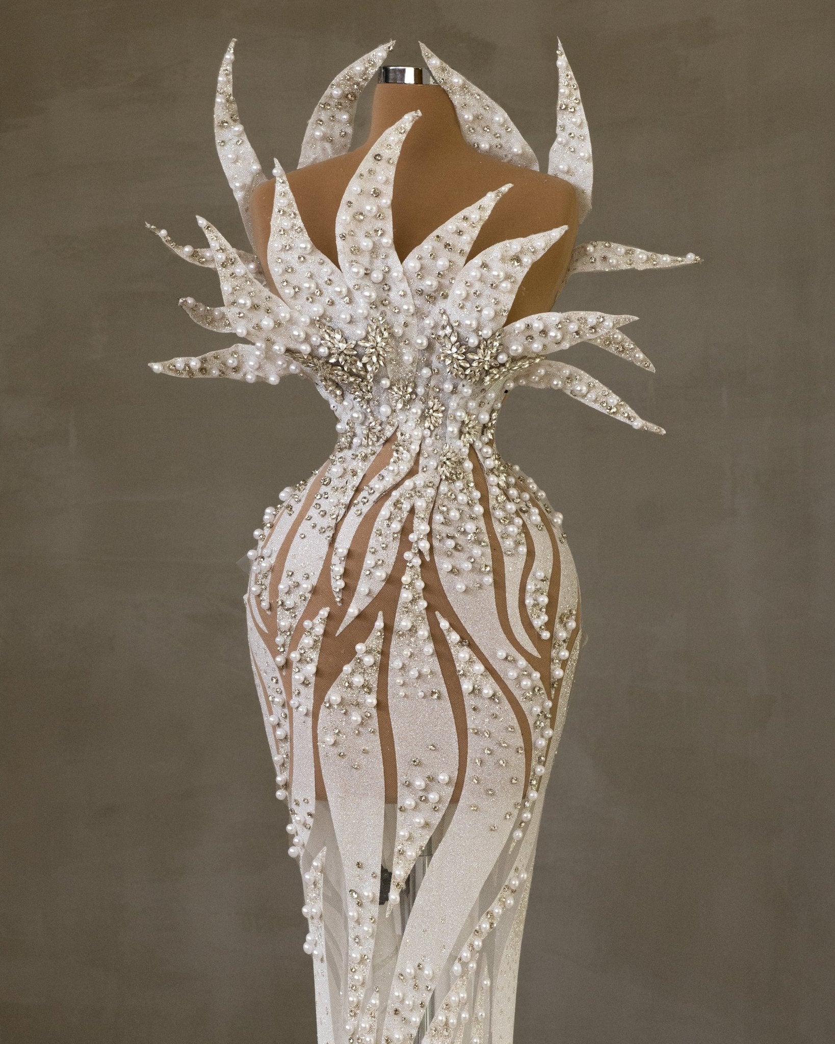 Elegant Sleeveless Bridal Gown with Pearl Embellishments