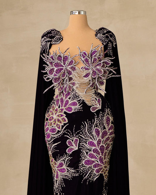 Luxurious Velvet Dress with Floral Embellishments and Flowing Cape