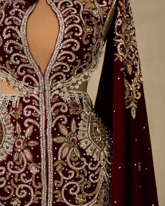 Detailed View of Velvet Gown with Ornate Stones and Attached Cape