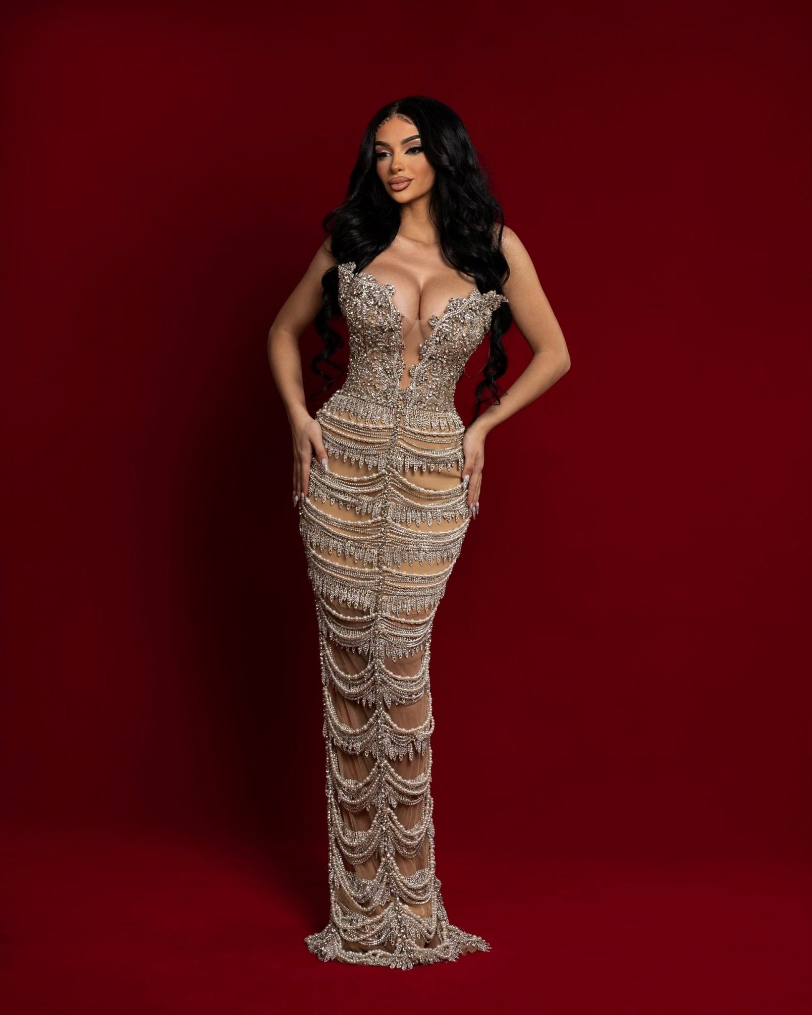 Image of Klarisa Cena showcasing her elegance and style in an exquisite tassel-embellished dress by Blini.