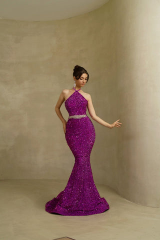 Front view of a purple twist neck sleeveless dress with a fitted silhouette and intricate details.