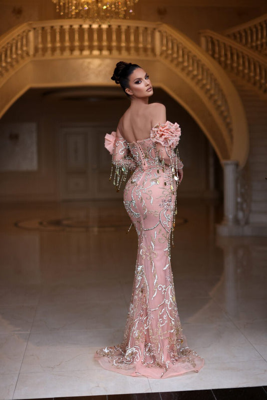 Stylish off-shoulder dress with intricate beading.