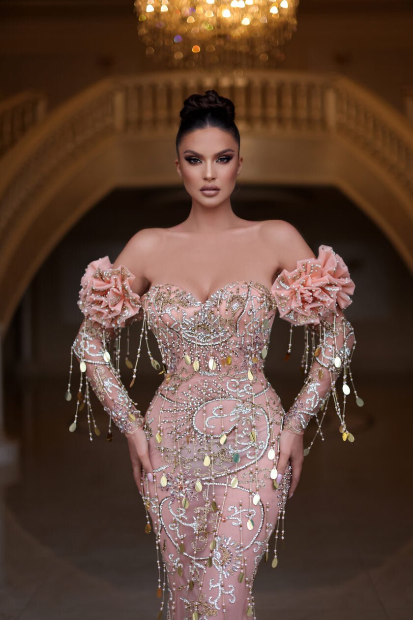 Elegant off-shoulder evening gown in a flowing silhouette.