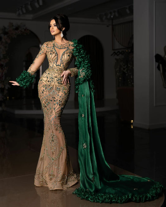 Green dress with long sleeves and side cape