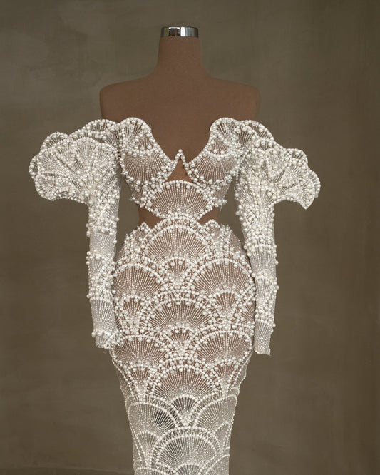 Off-shoulder bridal dress with intricate pearl embellishments