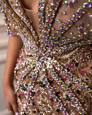 Sparkling crystals intricately adorn this luxurious long dress.