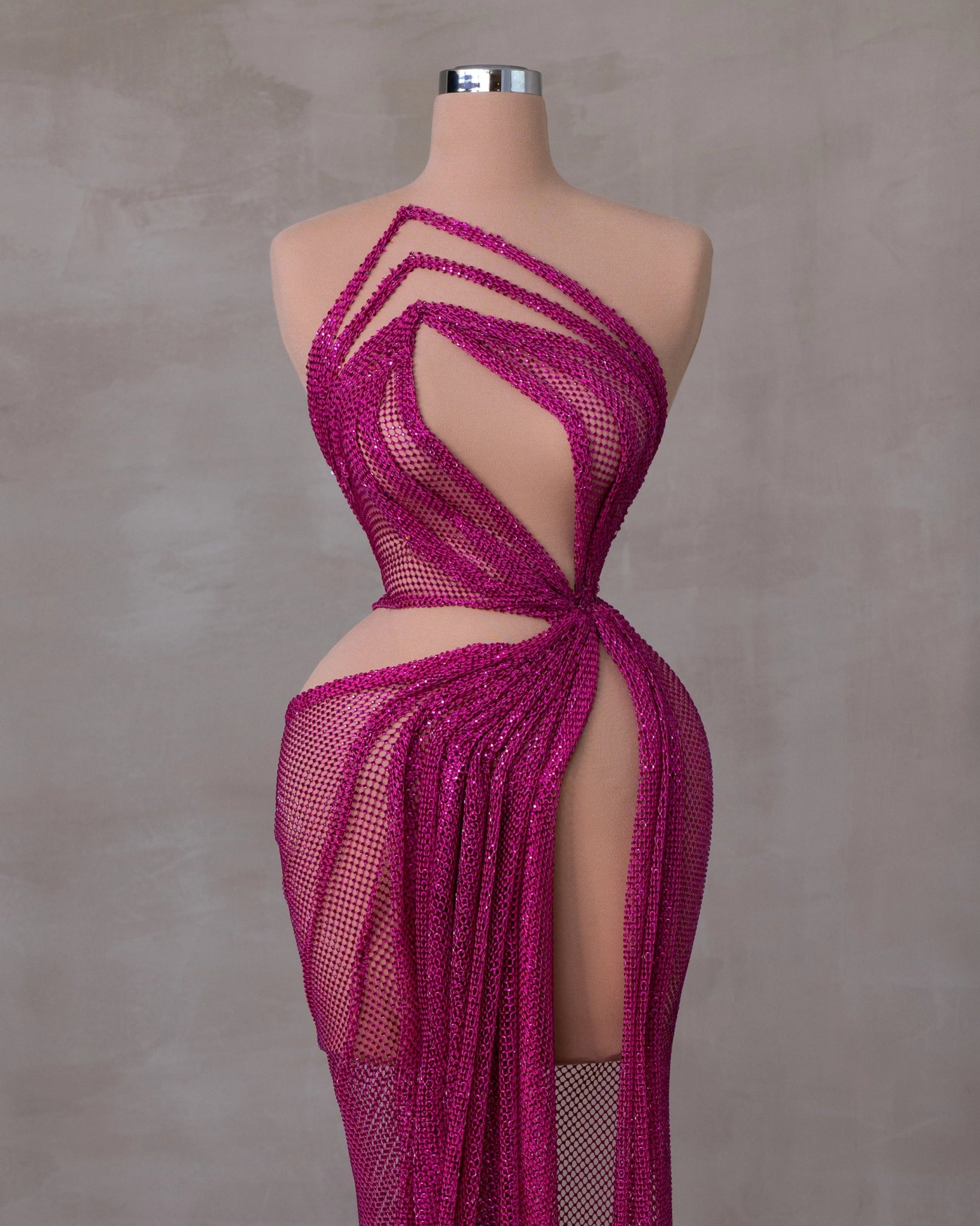 Elegant Sleeveless Dress Featuring Striking Cut-Outs and Dramatic Slit