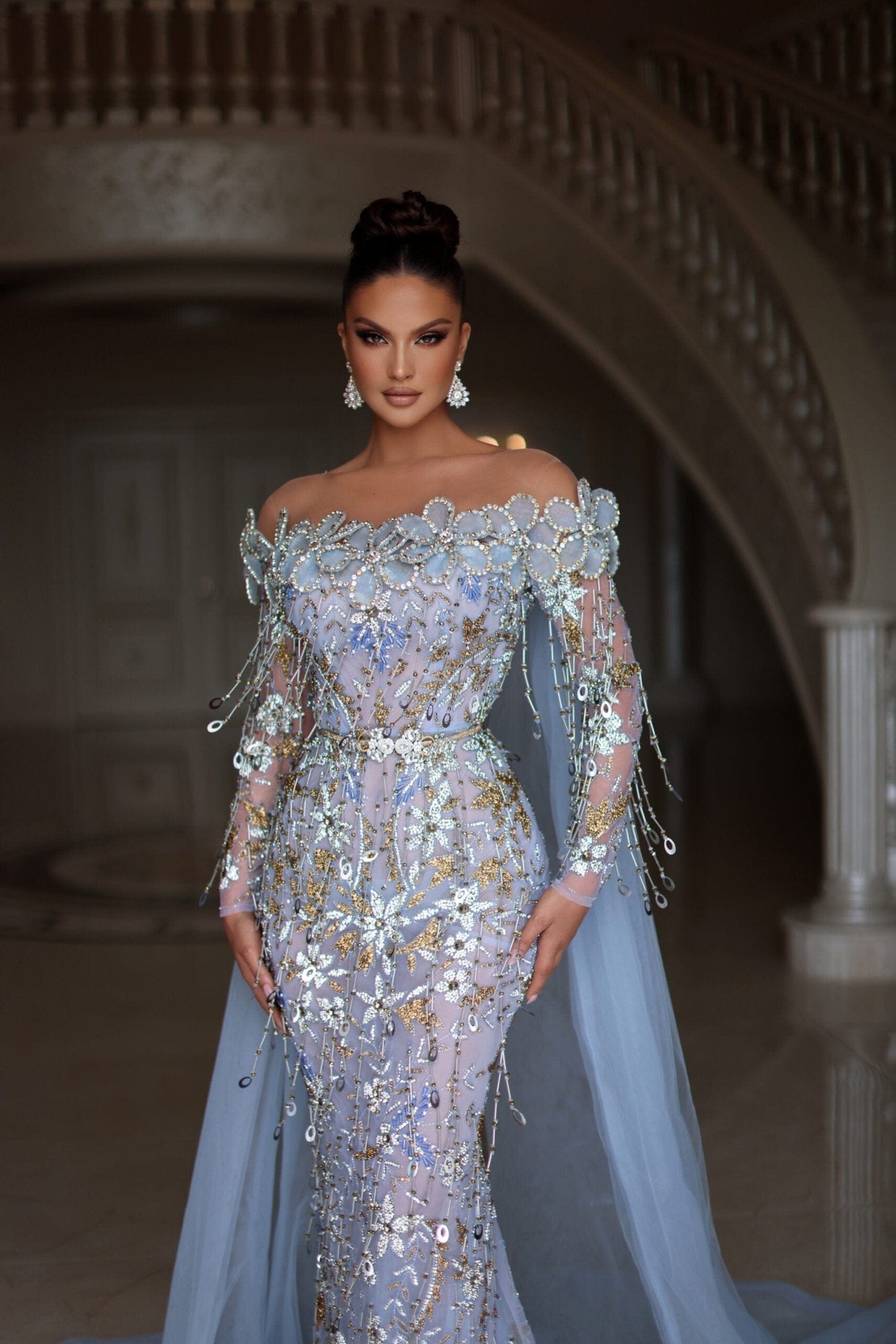 Baby blue dress with stones, flowers and tassels