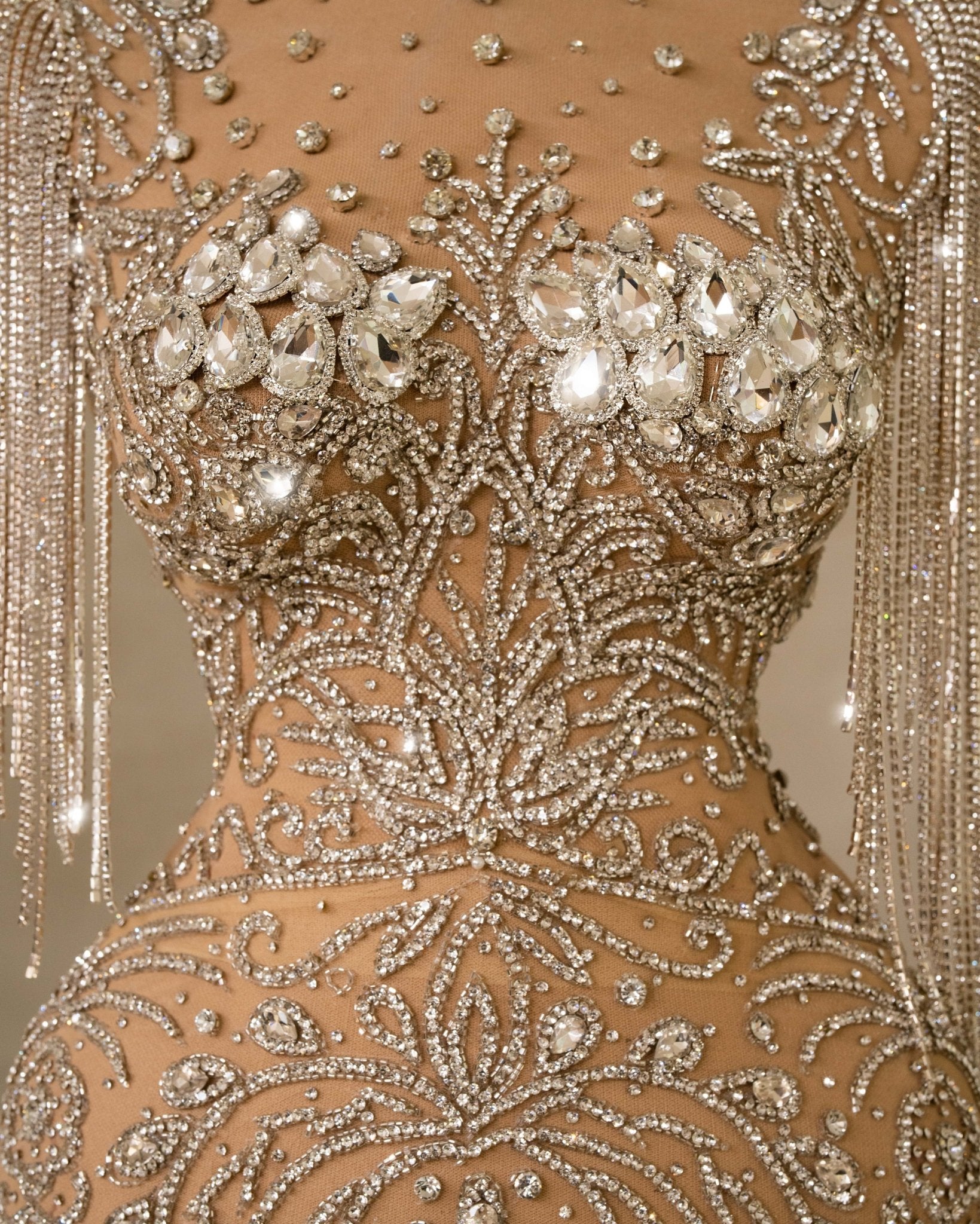 Close-up of Rhinestone Embellishments on Silver Dress