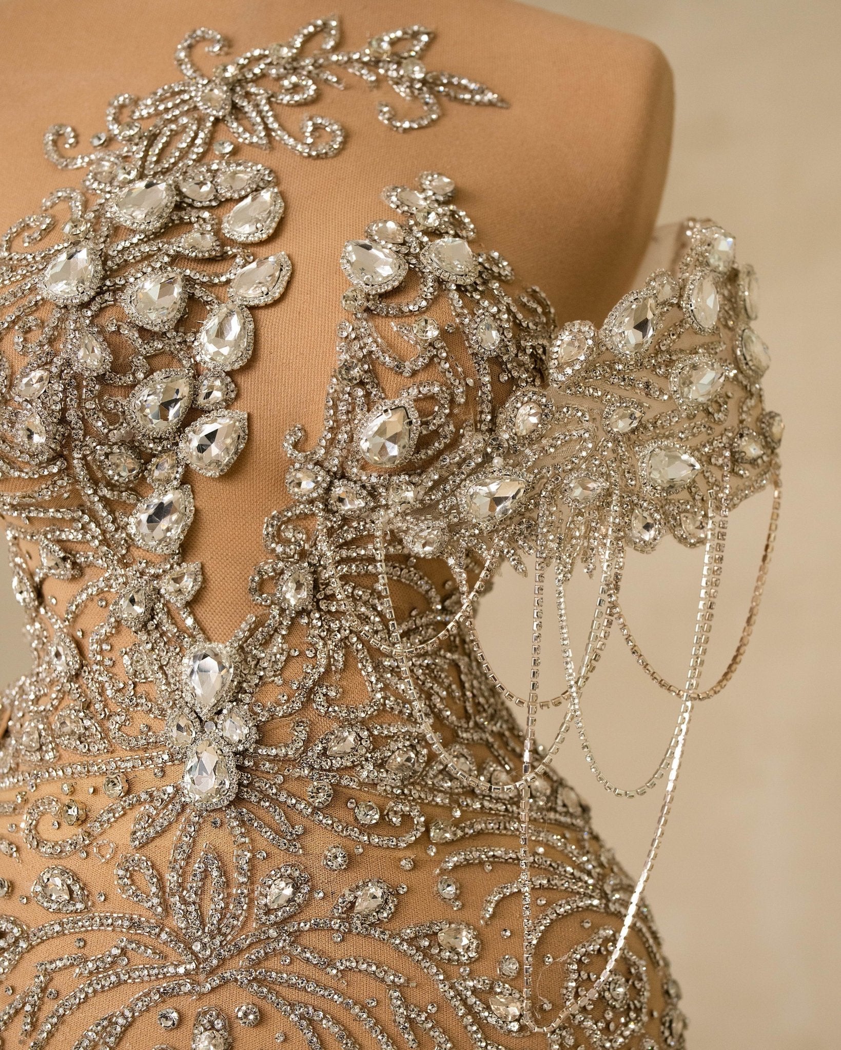 Close-up of Silver Dress Bodice with Embroidered Champagne Tail